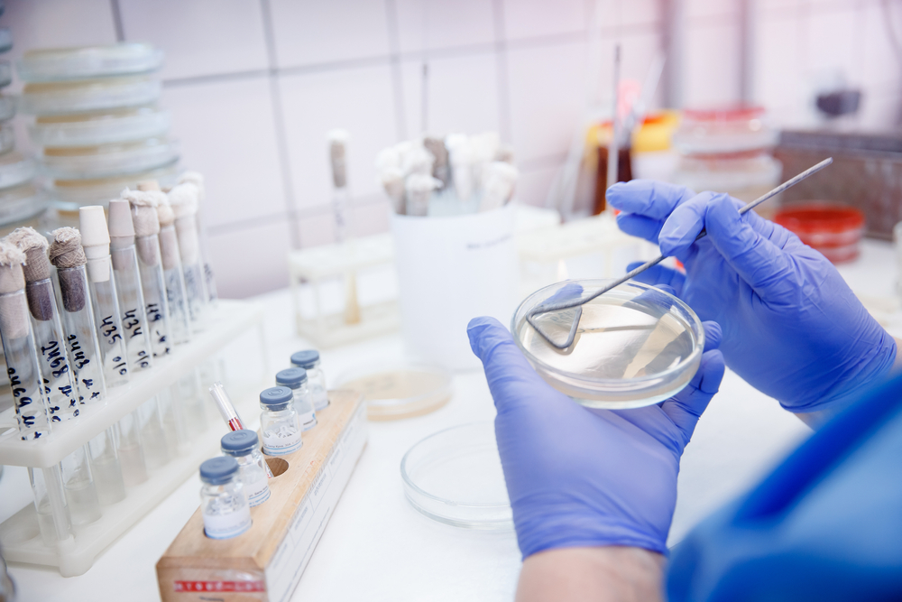 medical-specialist-presenting-coronavirus-using-tablet-sitting-desk-medical-office